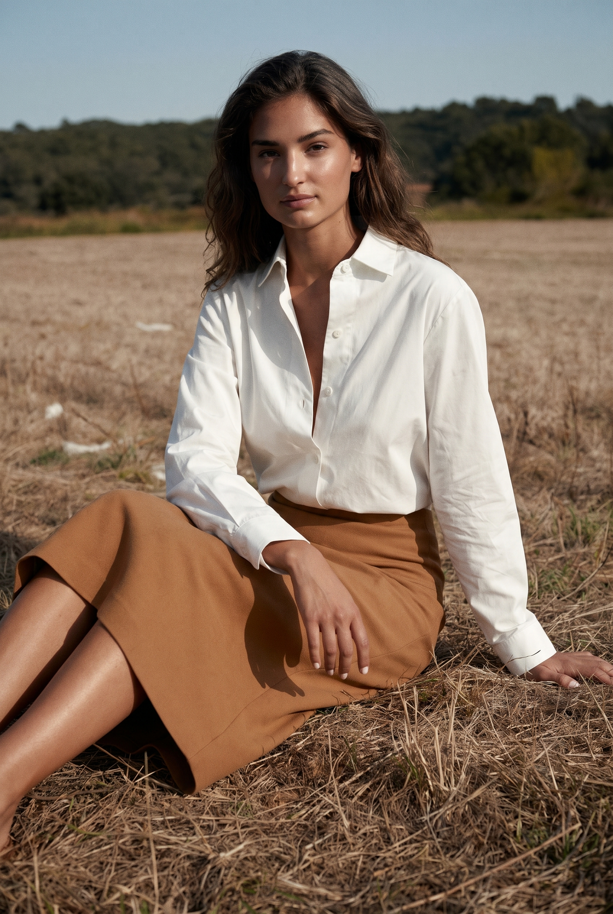 The Ivy Blouse in White, seated