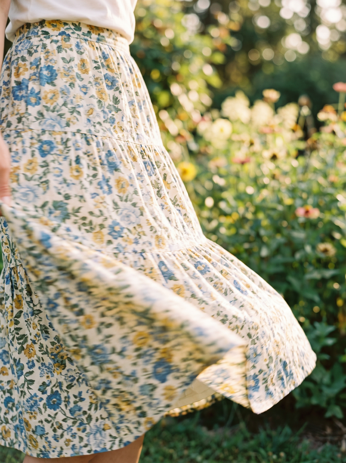 A floral cotton skirt swinging out mid spin