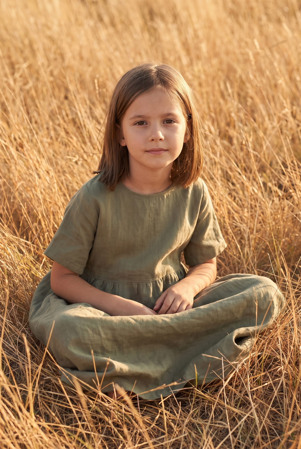 The Yarrow Mini in Olive, seated