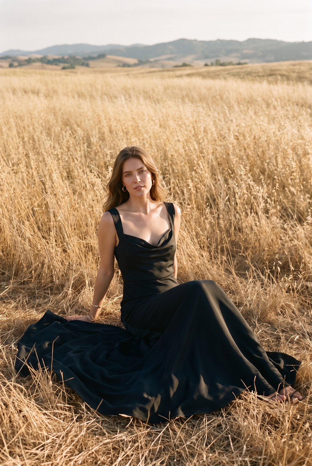 The Delphine Maxi in Noir, seated