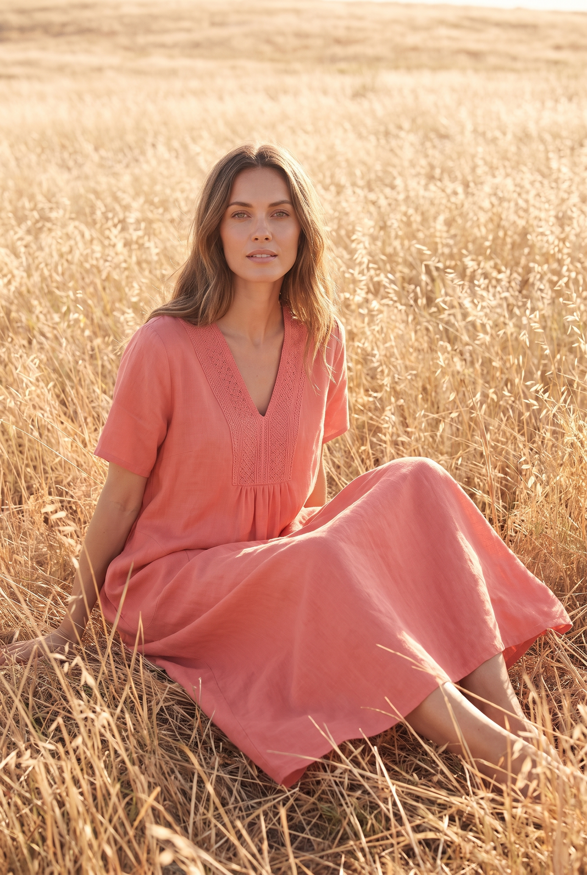 The Rosalind Maxi in Coral, seated