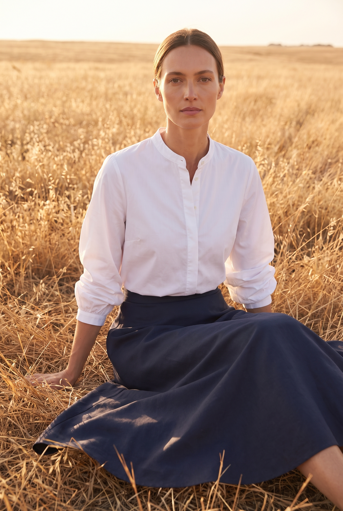The Bramble Blouse in White, seated
