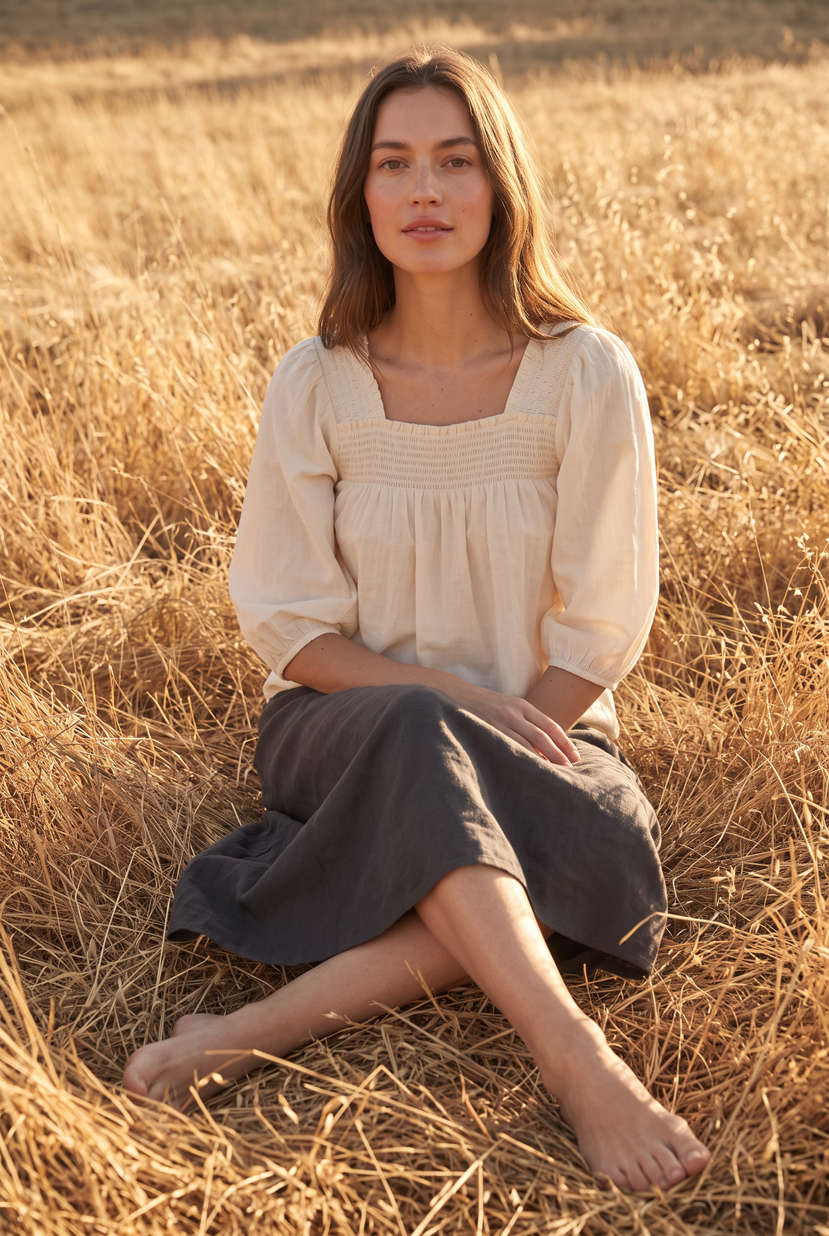The Saffron Blouse in Cream, seated